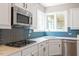 Well-equipped kitchen features modern appliances and countertops with stylish backsplash at 2941 Grandview Heights Lane Ln, Raleigh, NC 27614