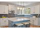 Stylish kitchen features a quartz island, custom cabinets, and a tiled backsplash at 2941 Grandview Heights Lane Ln, Raleigh, NC 27614