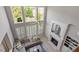 Sun-drenched living room boasts soaring ceilings, large windows, and an elegant fireplace at 2941 Grandview Heights Lane Ln, Raleigh, NC 27614