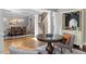 Inviting living space with hardwood floors, elegant columns, and a view into the dining area and staircase at 2941 Grandview Heights Lane Ln, Raleigh, NC 27614