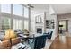 Comfortable living room featuring tall windows, a fireplace, and built-in shelving at 2941 Grandview Heights Lane Ln, Raleigh, NC 27614
