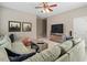Spacious living room featuring a plush sectional sofa, a modern coffee table, and two framed prints at 2941 Grandview Heights Lane Ln, Raleigh, NC 27614
