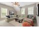 Comfortable living room with a large sectional sofa, a unique coffee table, and three bright windows at 2941 Grandview Heights Lane Ln, Raleigh, NC 27614