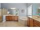 Beautiful bathroom features a soaking tub, separate shower, double sinks, and wood cabinets at 2941 Grandview Heights Lane Ln, Raleigh, NC 27614