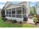 Exterior view of screened porch with a grill and patio seating on the brick patio at 2941 Grandview Heights Lane Ln, Raleigh, NC 27614