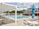 Community pool with seating, umbrellas, and lounging area surrounded by well-maintained landscaping at 2941 Grandview Heights Lane Ln, Raleigh, NC 27614