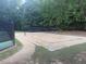 Sand volleyball court surrounded by trees, perfect for outdoor recreation and community fun at 2941 Grandview Heights Lane Ln, Raleigh, NC 27614