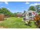 Expansive backyard featuring two storage sheds and well-maintained lawn perfect for outdoor activities at 302 Bradley St, Burlington, NC 27215