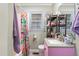 Bathroom featuring a pink vanity and shower/tub combo with colorful shower curtain at 302 Bradley St, Burlington, NC 27215