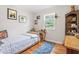 Bedroom with hardwood floors, a single bed, and a cozy rug at 302 Bradley St, Burlington, NC 27215