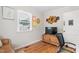 Bedroom with hardwood floors, a leather chair and a desk with a rolling office chair at 302 Bradley St, Burlington, NC 27215