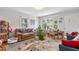 Comfortable living room with hardwood floors and plenty of natural light from the windows at 302 Bradley St, Burlington, NC 27215