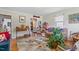 Cozy living room with hardwood floors, rug, and an open doorway to kitchen at 302 Bradley St, Burlington, NC 27215