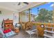 Relaxing porch with ceiling fan, complemented by rustic wooden decor and comfortable seating at 302 Bradley St, Burlington, NC 27215