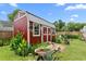 Garden shed featuring a deck, providing outdoor storage and enhancing the backyard landscape at 302 Bradley St, Burlington, NC 27215