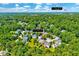 Lush, green, aerial view of community with downtown Raleigh visible in the distance at 3217 Enchanting Way, Raleigh, NC 27616