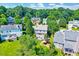 An aerial view showcasing the home, its surrounding landscaping, and neighborhood at 3217 Enchanting Way, Raleigh, NC 27616