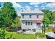 Expansive backyard featuring a deck, patio, green grass, and mature trees, ideal for outdoor living at 3217 Enchanting Way, Raleigh, NC 27616