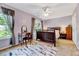 A cozy bedroom with a makeup vanity, comfortable bed, and natural light at 3217 Enchanting Way, Raleigh, NC 27616
