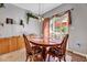 Inviting dining area enhanced with a stylish wooden table, large window, and natural light at 3217 Enchanting Way, Raleigh, NC 27616