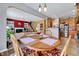 Cozy dining room complemented by a charming round wooden table and kitchen access at 3217 Enchanting Way, Raleigh, NC 27616
