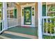 Inviting front porch with decorative glass door, neutral siding, and painted steps for a warm welcome at 3217 Enchanting Way, Raleigh, NC 27616