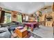Large game room featuring a pool table, comfortable couch, and stairs to another level at 3217 Enchanting Way, Raleigh, NC 27616