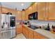 Bright kitchen featuring stainless steel appliances, ample counter space, and lots of wooden cabinet storage space at 3217 Enchanting Way, Raleigh, NC 27616