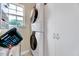 Efficient laundry room with modern stacked washer and dryer and ample storage space at 3217 Enchanting Way, Raleigh, NC 27616
