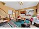 Open-concept living room with staircase access and views into the dining and kitchen areas at 3217 Enchanting Way, Raleigh, NC 27616