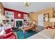 Comfortable living room with a fireplace, built-in shelves, and seamless access to the staircase at 3217 Enchanting Way, Raleigh, NC 27616