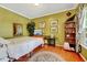Cozy main bedroom with hardwood floors, a comfortable queen bed, and plenty of natural light at 3217 Enchanting Way, Raleigh, NC 27616