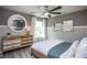 Bedroom featuring a modern dresser with a round mirror and a cozy bed at 331 Bridle Brook Way, Fuquay Varina, NC 27526