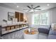 Bright living room featuring a ceiling fan, recessed lighting, and decorative shelving unit at 331 Bridle Brook Way, Fuquay Varina, NC 27526