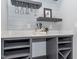 Stylish bar area with quartz countertop, open shelving, wine rack, and elegant glassware for entertaining guests at 335 Glenn St, Franklinton, NC 27525