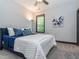 Bedroom featuring carpet floors, a large window, and stylish decor and accents at 335 Glenn St, Franklinton, NC 27525