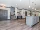 Open living space with kitchen, stairs, and bar area at 335 Glenn St, Franklinton, NC 27525