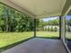 Covered outdoor patio overlooking a spacious backyard and landscaping at 335 Glenn St, Franklinton, NC 27525