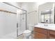 Clean bathroom featuring a tiled shower, modern fixtures, and a vanity with ample storage at 3504 Regent Pines Dr, New Hill, NC 27562