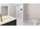 Well-lit bathroom showcasing a tiled shower with glass accents and a white countertop at 3504 Regent Pines Dr, New Hill, NC 27562