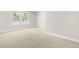 Bright bedroom with large window and neutral carpet at 3504 Regent Pines Dr, New Hill, NC 27562