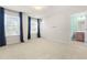 Bright bedroom with large windows and a view of the en suite bathroom at 3504 Regent Pines Dr, New Hill, NC 27562