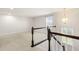 Bonus room with high ceilings and a view of the staircase at 3504 Regent Pines Dr, New Hill, NC 27562