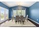 Dining room with a large table, an area rug, and lots of natural light at 3504 Regent Pines Dr, New Hill, NC 27562
