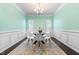 Chic dining room with ample natural light and a modern table setting, perfect for Gathering gatherings at 3504 Regent Pines Dr, New Hill, NC 27562