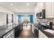 Bright kitchen featuring stainless steel appliances and a view of the dining room at 3504 Regent Pines Dr, New Hill, NC 27562