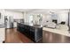 Modern kitchen with granite countertops, stainless steel appliances, and hardwood floors at 3504 Regent Pines Dr, New Hill, NC 27562