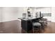 Stylish kitchen island with a dark finish, offering ample seating and prep space at 3504 Regent Pines Dr, New Hill, NC 27562