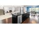 Elegant kitchen island connects to the living room, creating a seamless flow in the home at 3504 Regent Pines Dr, New Hill, NC 27562
