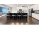 Contemporary kitchen with stainless steel appliances, granite counters and a large kitchen island at 3504 Regent Pines Dr, New Hill, NC 27562